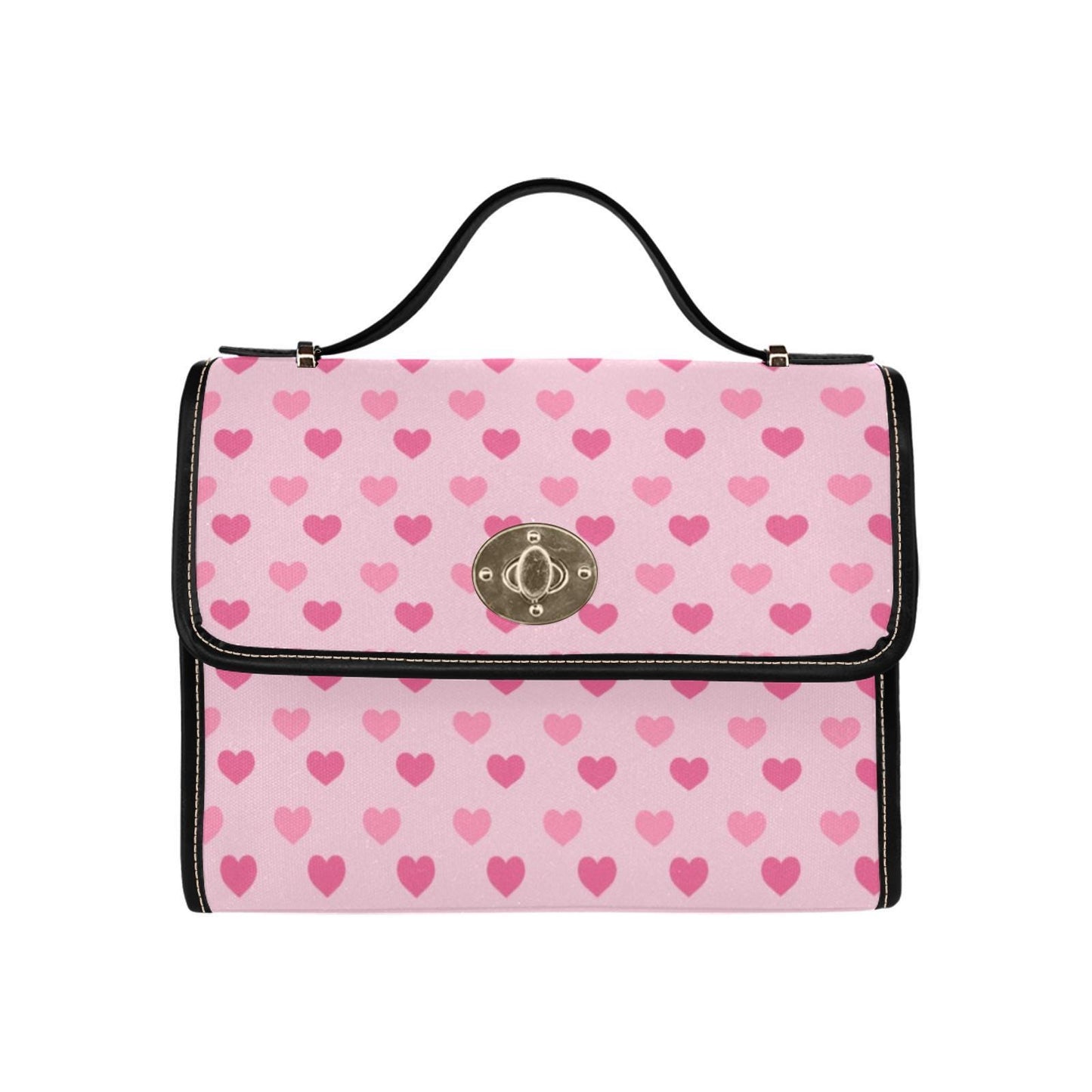 a pink and black purse with hearts on it