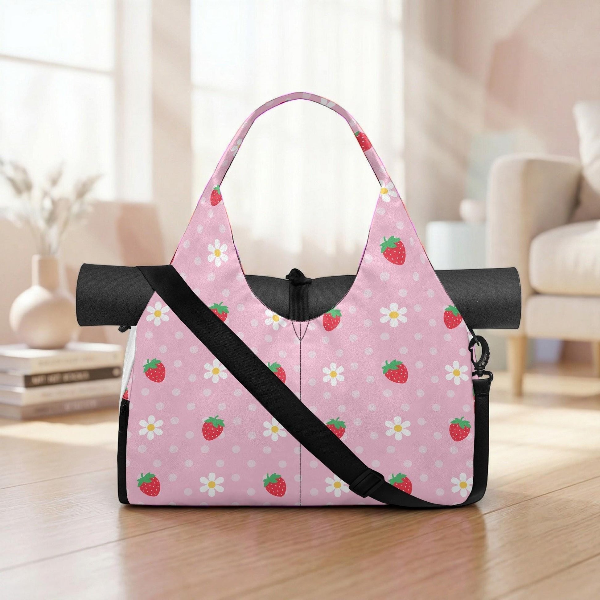 A pink tote bag with a strawberry and white polka dot pattern is displayed on a wooden floor in a room with a window and a couch.